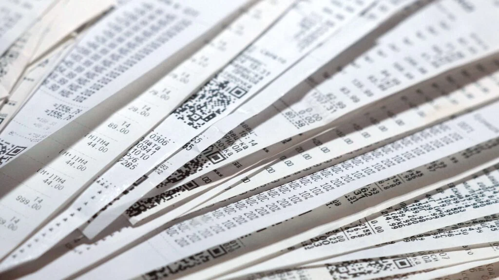 Close-up of stacked receipts